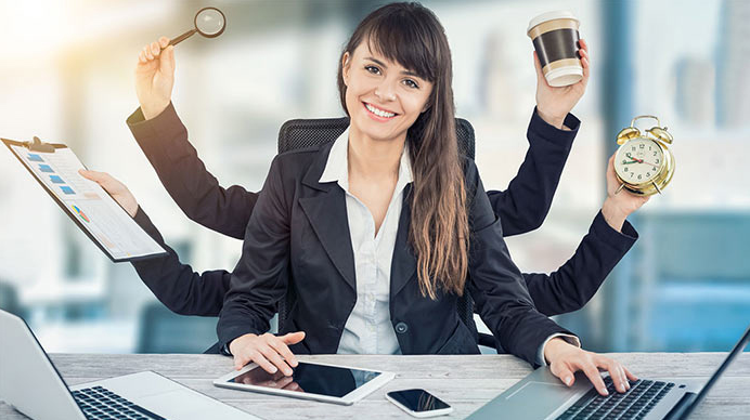 home-based business - Lady at her desk with multiple arms for all the different tasks she has to do as a home business owner