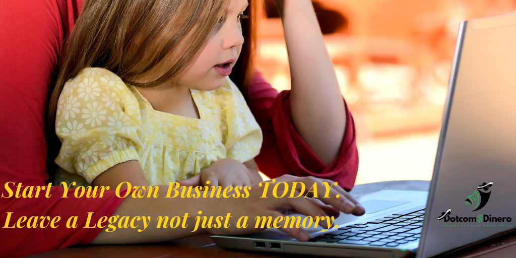 Mom working on her online business from her laptop with her young daughter sitting in her lap