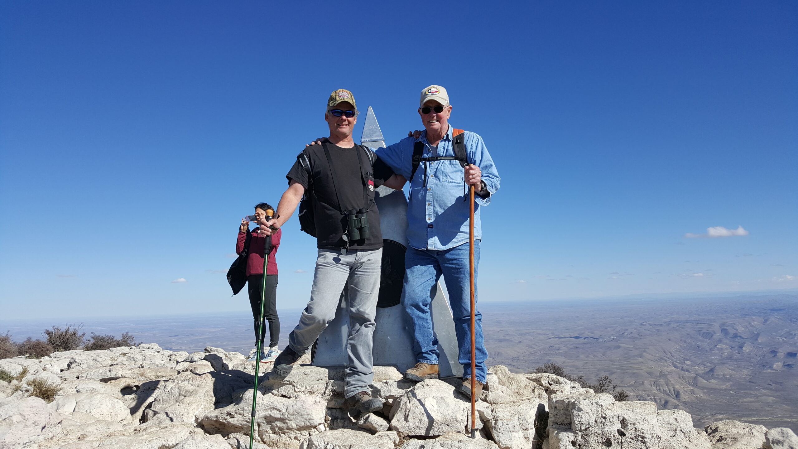 Rex and JT McMahon standing at the top of Guadalupe Peak in Texas