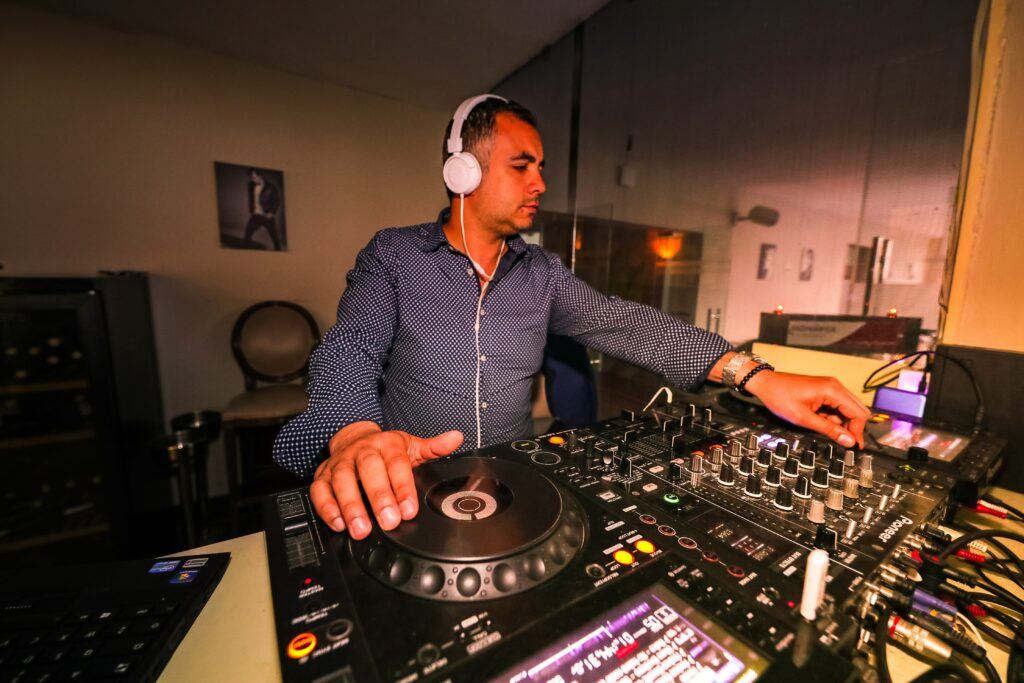 Music recording studio with man mixing tracks