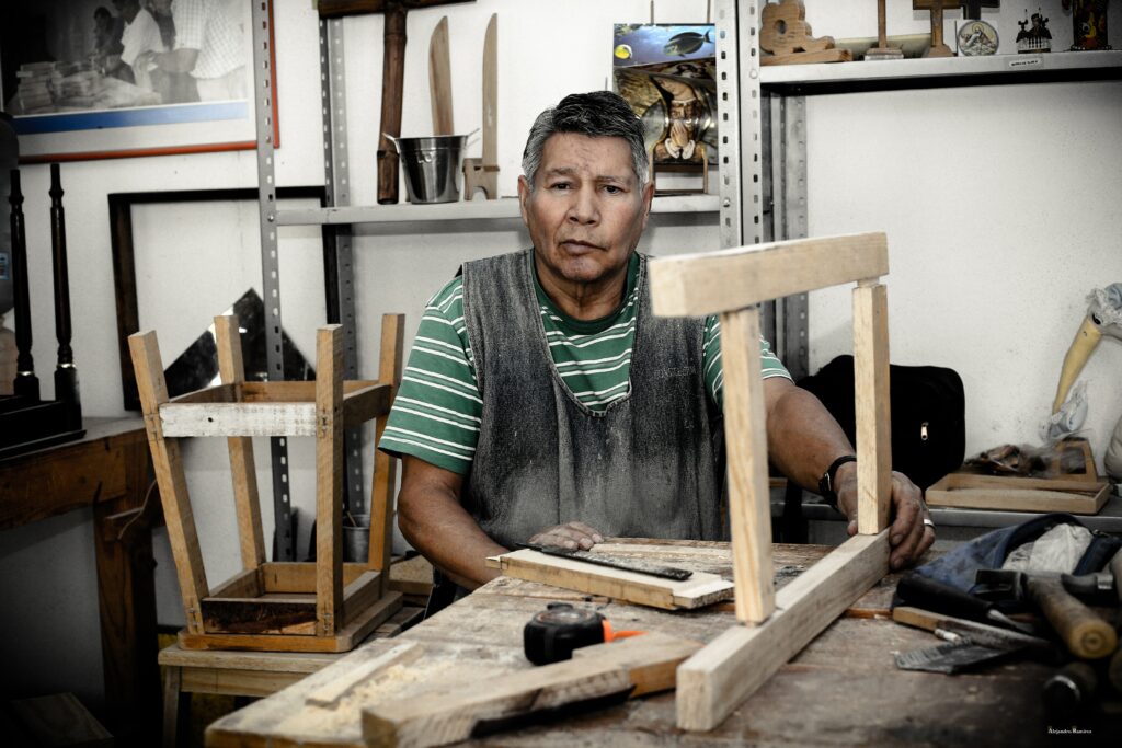 Craftsman building a stool as a woodworking project